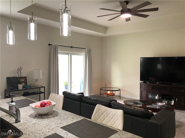 1530 NW 25th Ave, Cape Coral, FL 33993 - living area featuring a ceiling fan, baseboards, and carpet floors