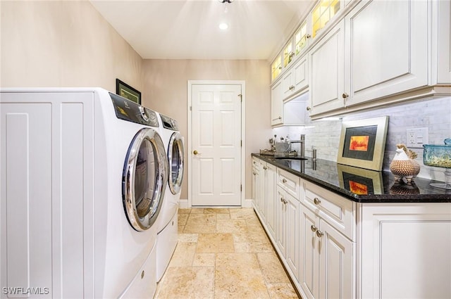 8241 Glenfinnan Cir, Fort Myers, FL 33912 - laundry room featuring washing machine and clothes dryer, stone tile floors, cabinet space, baseboards, and recessed lighting