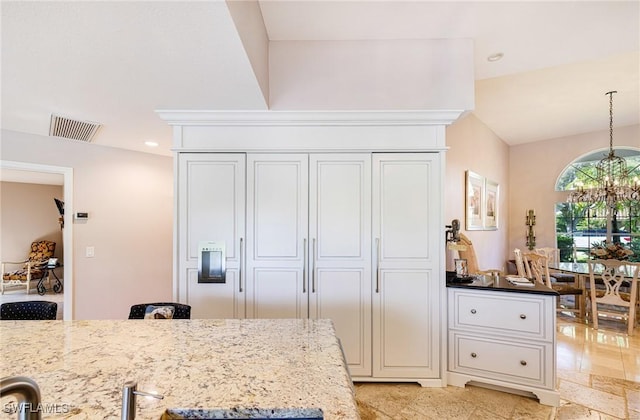 8241 Glenfinnan Cir, Fort Myers, FL 33912 - kitchen with a chandelier, light stone counters, decorative light fixtures, recessed lighting, and white cabinets