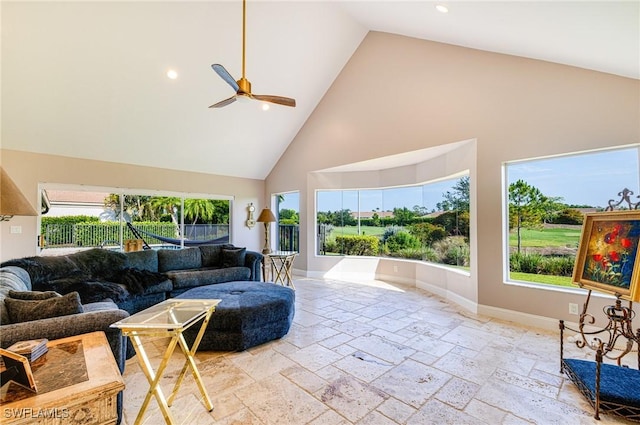 8241 Glenfinnan Cir, Fort Myers, FL 33912 - living room featuring high vaulted ceiling, ceiling fan, stone tile flooring, recessed lighting, and baseboards