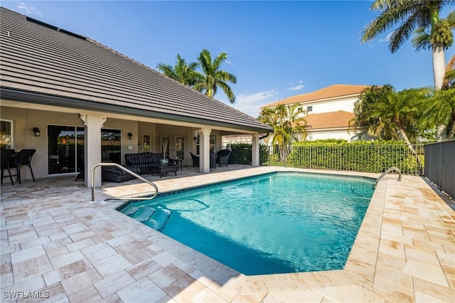 8241 Glenfinnan Cir, Fort Myers, FL 33912 - view of swimming pool with a patio area and french doors