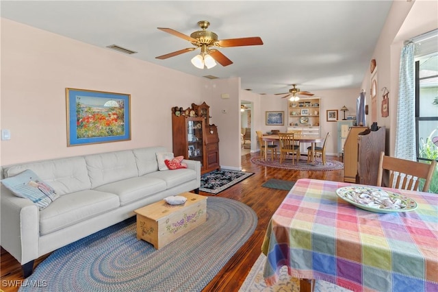 7690 Castleberry Ter, Englewood, FL 34224 - living room with wood finished floors, ceiling fan, and baseboards
