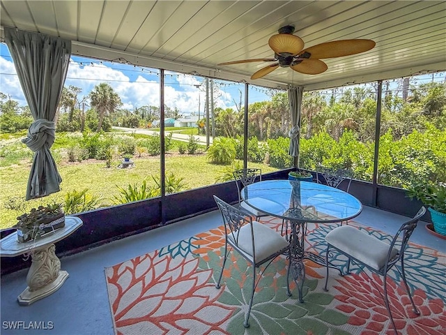 7690 Castleberry Ter, Englewood, FL 34224 - sunroom / solarium featuring a ceiling fan and outdoor dining space