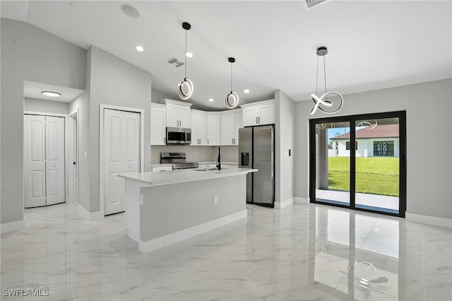 4011 7th St SW, Lehigh Acres, FL 33976 - kitchen with stainless steel appliances, light marble finish flooring, lofted ceiling, recessed lighting, and light countertops
