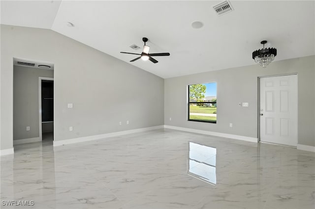 4011 7th St SW, Lehigh Acres, FL 33976 - unfurnished room featuring vaulted ceiling, a ceiling fan, light marble finish flooring, and a chandelier