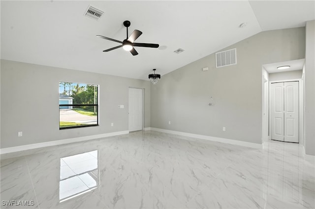 4011 7th St SW, Lehigh Acres, FL 33976 - empty room featuring vaulted ceiling, ceiling fan, and light marble finish floors