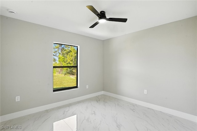 4011 7th St SW, Lehigh Acres, FL 33976 - unfurnished room featuring marble finish flooring, a smoke detector, and ceiling fan