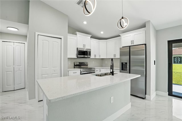 4011 7th St SW, Lehigh Acres, FL 33976 - kitchen featuring appliances with stainless steel finishes, light marble finish flooring, white cabinetry, light stone countertops, and recessed lighting