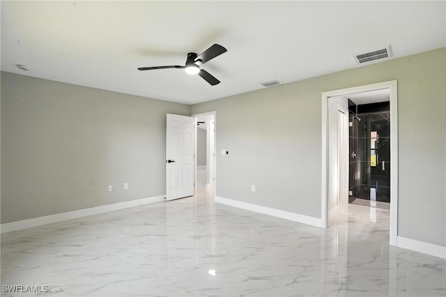 4011 7th St SW, Lehigh Acres, FL 33976 - unfurnished bedroom with light marble finish floors and ceiling fan