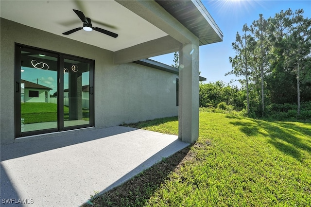 4011 7th St SW, Lehigh Acres, FL 33976 - view of grassy yard with a ceiling fan and a patio area