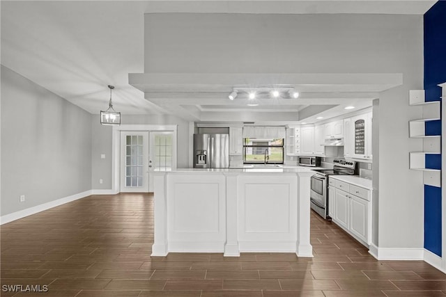 1311 SE 11th St, Cape Coral, FL 33990 - kitchen with stainless steel appliances, a sink, wood tiled floors, and light countertops