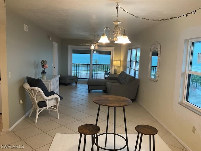 6897 Estero Blvd Unit 166, Fort Myers Beach, FL 33931 - living room with healthy amount of natural light, a chandelier, and light tile patterned floors
