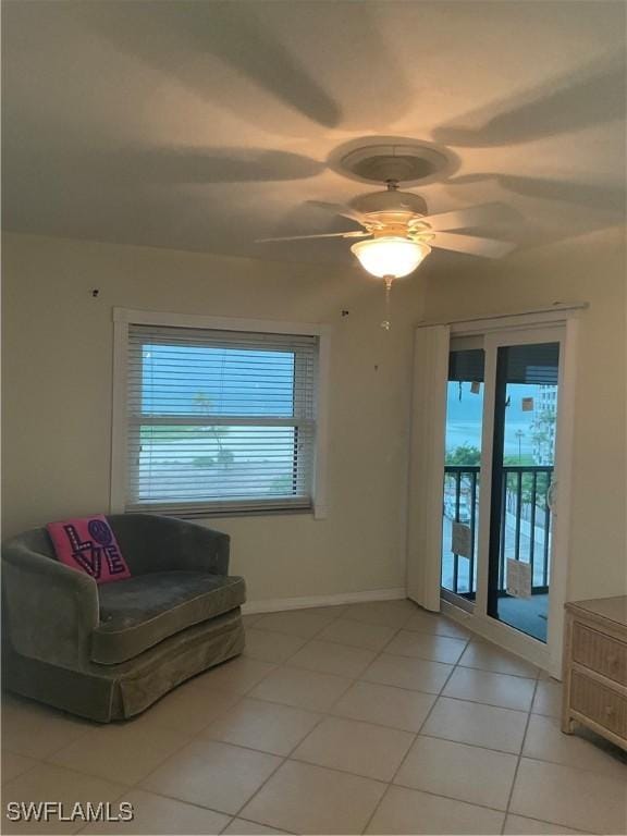 6897 Estero Blvd Unit 166, Fort Myers Beach, FL 33931 - living room with light tile patterned floors, plenty of natural light, and ceiling fan