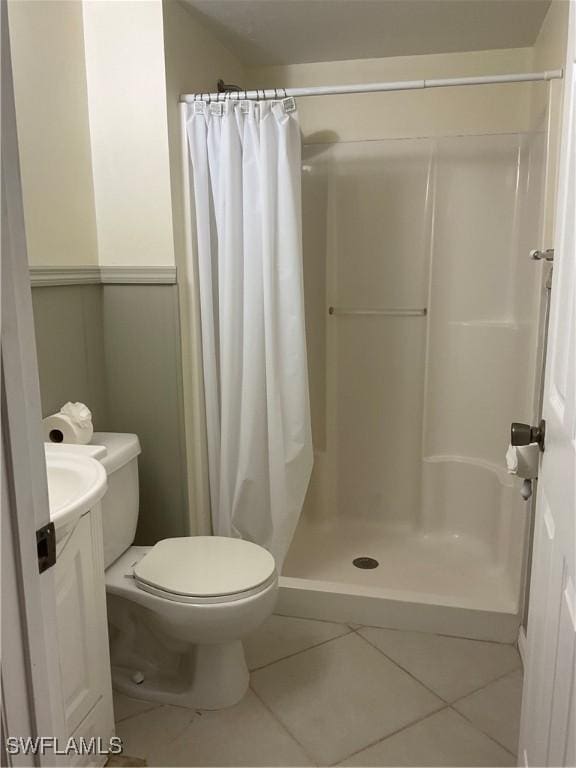6897 Estero Blvd Unit 166, Fort Myers Beach, FL 33931 - bathroom featuring tile patterned floors, vanity, and a shower with shower curtain