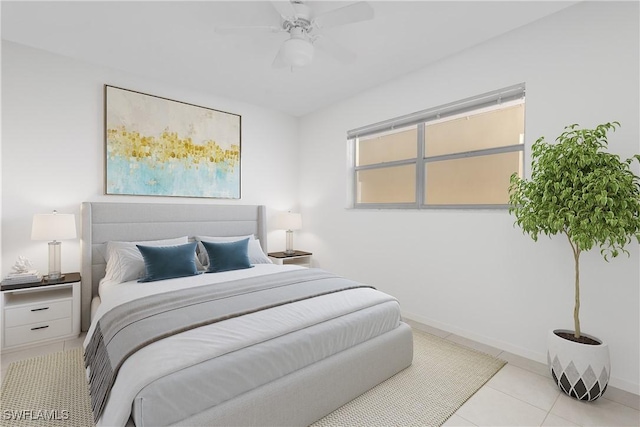 900 8th Ave S Unit 102, Naples, FL 34102 - bedroom with baseboards, light tile patterned flooring, and a ceiling fan