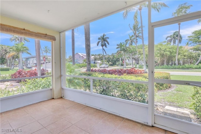 900 8th Ave S Unit 102, Naples, FL 34102 - unfurnished sunroom with tile patterned floors