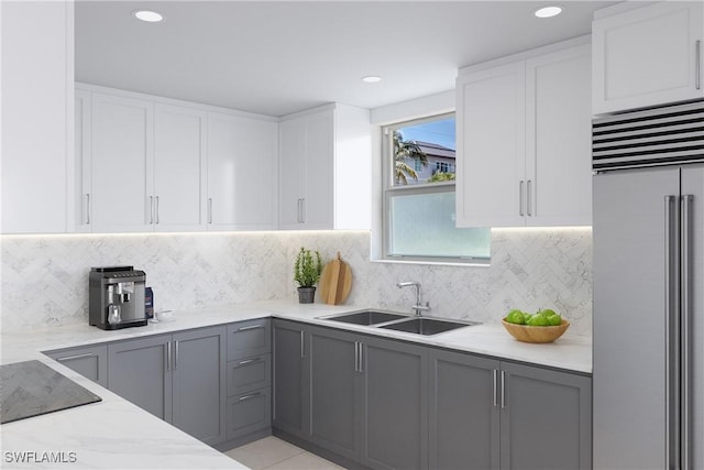 900 8th Ave S Unit 102, Naples, FL 34102 - kitchen featuring high end refrigerator, a sink, gray cabinets, light stone counters, and recessed lighting