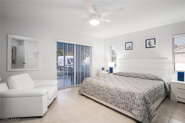 227 SW 48th Ter, Cape Coral, FL 33914 - bedroom featuring access to exterior, light tile patterned floors, and ceiling fan