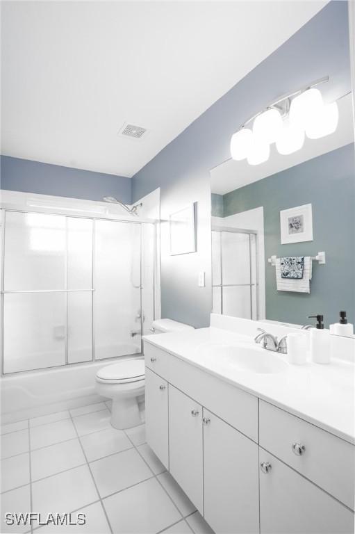 227 SW 48th Ter, Cape Coral, FL 33914 - full bathroom featuring vanity, toilet, and enclosed tub / shower combo