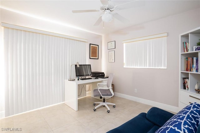 227 SW 48th Ter, Cape Coral, FL 33914 - tiled office space featuring a ceiling fan and baseboards