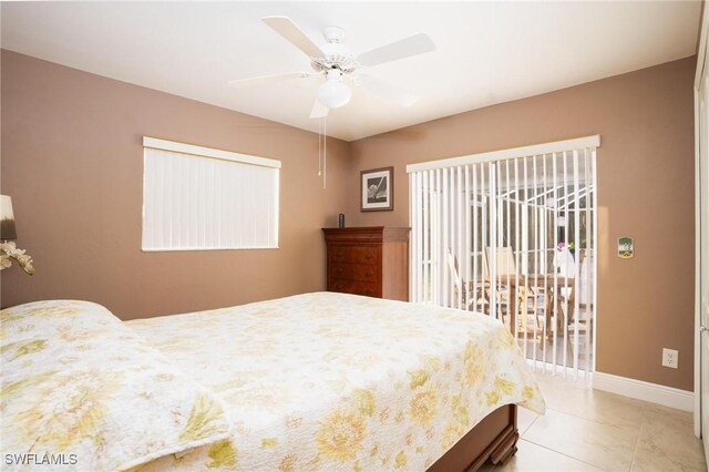 227 SW 48th Ter, Cape Coral, FL 33914 - bedroom featuring access to outside, baseboards, ceiling fan, and multiple windows