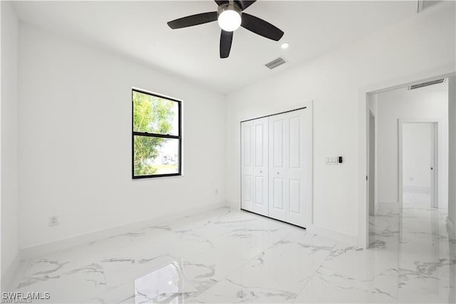 4309 NW 38th Ave, Cape Coral, FL 33993 - unfurnished bedroom with baseboards, marble finish flooring, recessed lighting, and a closet