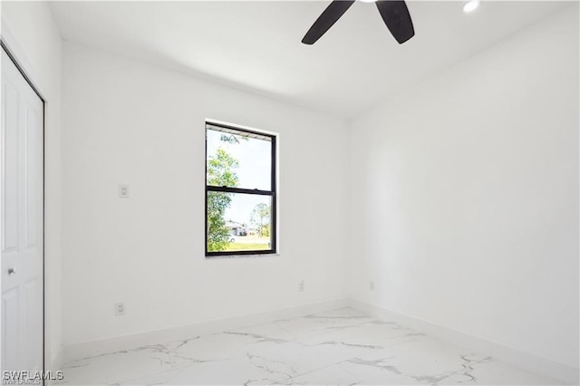 4309 NW 38th Ave, Cape Coral, FL 33993 - unfurnished bedroom featuring baseboards, marble look tiles, recessed lighting, a closet, and ceiling fan