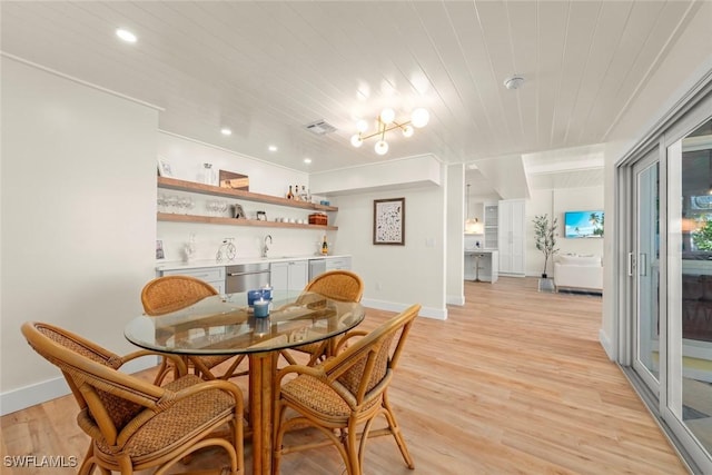 15009 Binder Dr, Captiva, FL 33924 - dining space with baseboards, light wood finished floors, recessed lighting, bar, and wood ceiling