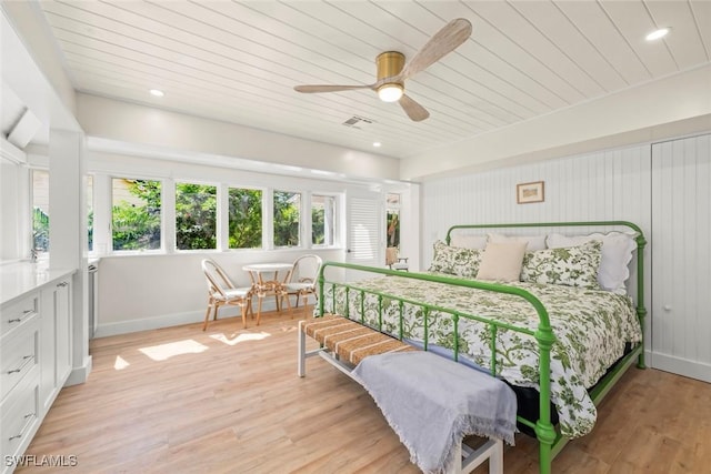 15009 Binder Dr, Captiva, FL 33924 - bedroom with light wood finished floors, wooden ceiling, baseboards, and a ceiling fan