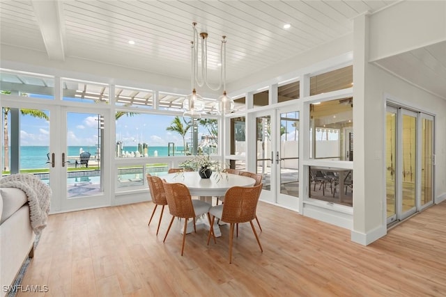 15009 Binder Dr, Captiva, FL 33924 - dining room with french doors, plenty of natural light, light wood-style flooring, wood ceiling, and recessed lighting