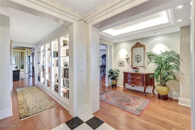 1920 Virginia Ave Unit 1602, Fort Myers, FL 33901 - hall featuring wood finished floors, a raised ceiling, baseboards, and crown molding