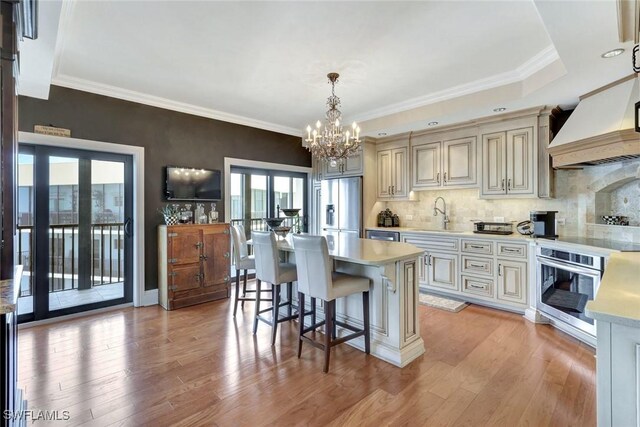 1920 Virginia Ave Unit 1602, Fort Myers, FL 33901 - kitchen with stainless steel appliances, a chandelier, light countertops, plenty of natural light, and crown molding