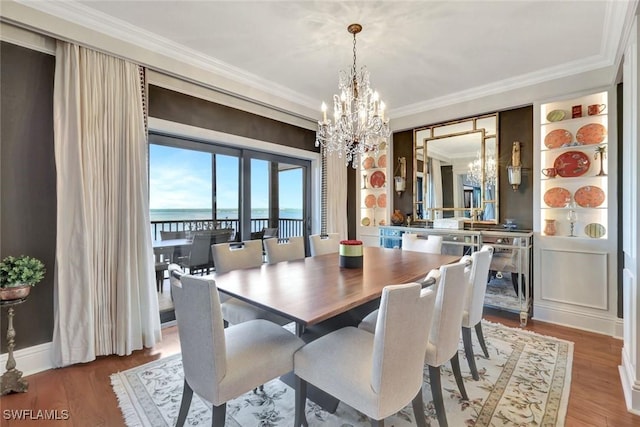 1920 Virginia Ave Unit 1602, Fort Myers, FL 33901 - dining area featuring a chandelier, ornamental molding, wood finished floors, and a water view