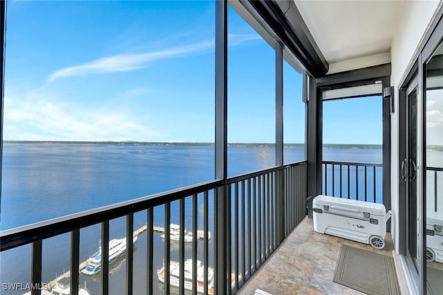 1920 Virginia Ave Unit 1602, Fort Myers, FL 33901 - unfurnished sunroom with a water view and stone finish flooring