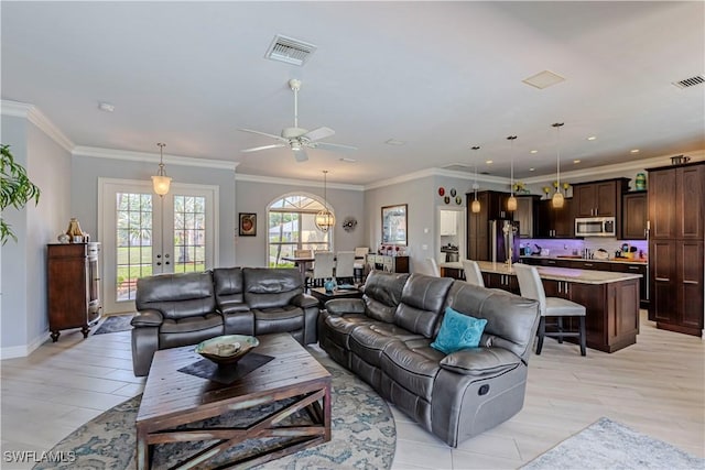 10630 Woodchuck Ln, Bonita Springs, FL 34135 - living room featuring light wood-style floors, a ceiling fan, french doors, baseboards, and ornamental molding