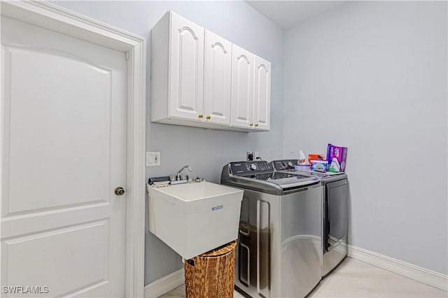 10630 Woodchuck Ln, Bonita Springs, FL 34135 - laundry area featuring independent washer and dryer, cabinet space, and baseboards
