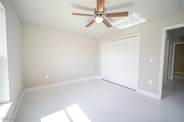 1893 Weldon Ave, Lehigh Acres, FL 33972 - unfurnished bedroom with a closet, baseboards, and ceiling fan