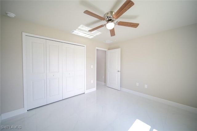 1893 Weldon Ave, Lehigh Acres, FL 33972 - unfurnished bedroom with a closet, baseboards, and ceiling fan