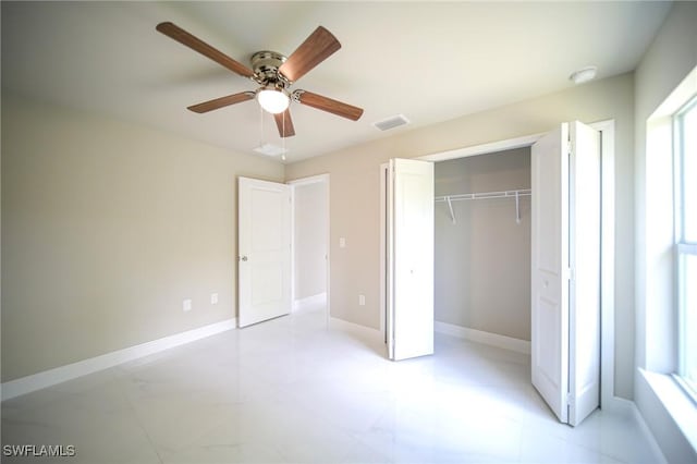 1893 Weldon Ave, Lehigh Acres, FL 33972 - unfurnished bedroom featuring a closet, ceiling fan, and baseboards