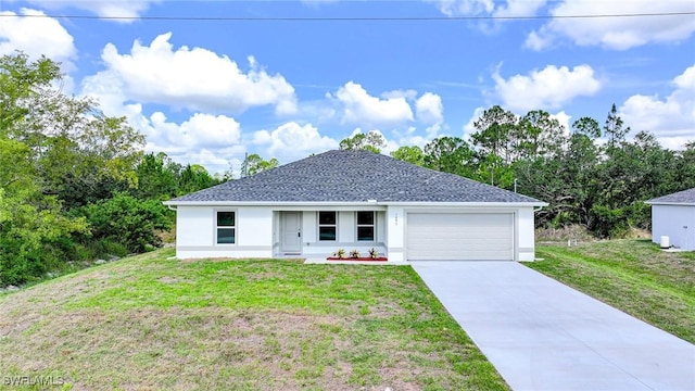 1893 Weldon Ave, Lehigh Acres, FL 33972 - view of front of property featuring stucco siding, a front yard, a garage, and driveway