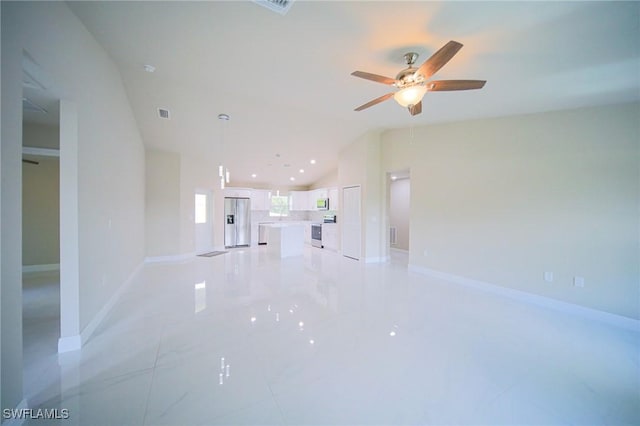 1893 Weldon Ave, Lehigh Acres, FL 33972 - unfurnished living room featuring vaulted ceiling, ceiling fan, and baseboards