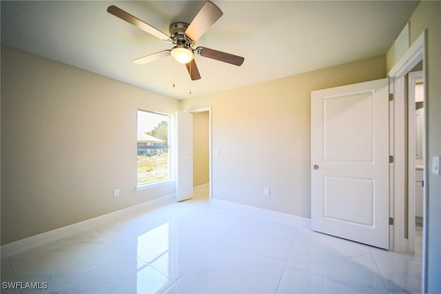 1895 Weldon Ave, Lehigh Acres, FL 33972 - unfurnished bedroom featuring a ceiling fan and baseboards