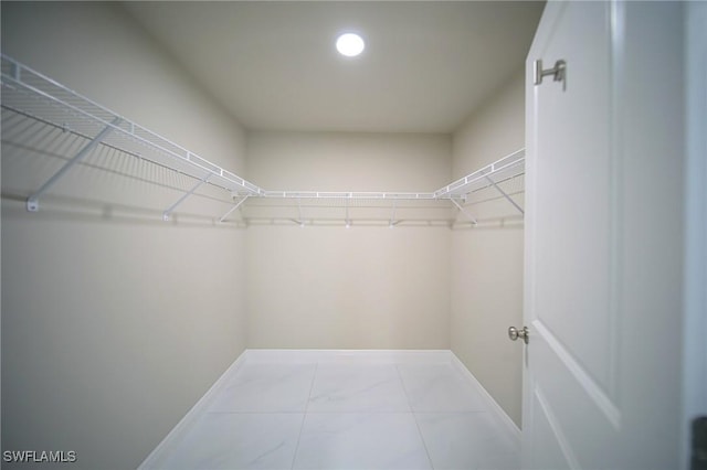 1895 Weldon Ave, Lehigh Acres, FL 33972 - spacious closet with marble look tile flooring