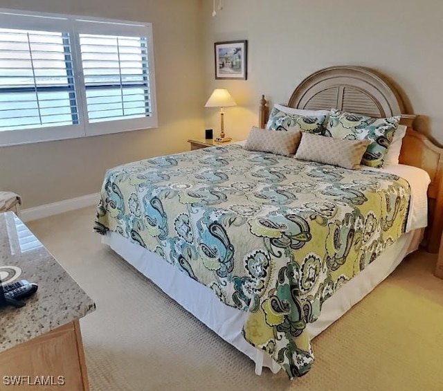 17170 Harbour Point Dr Unit 736, Fort Myers, FL 33908 - bedroom featuring carpet and baseboards