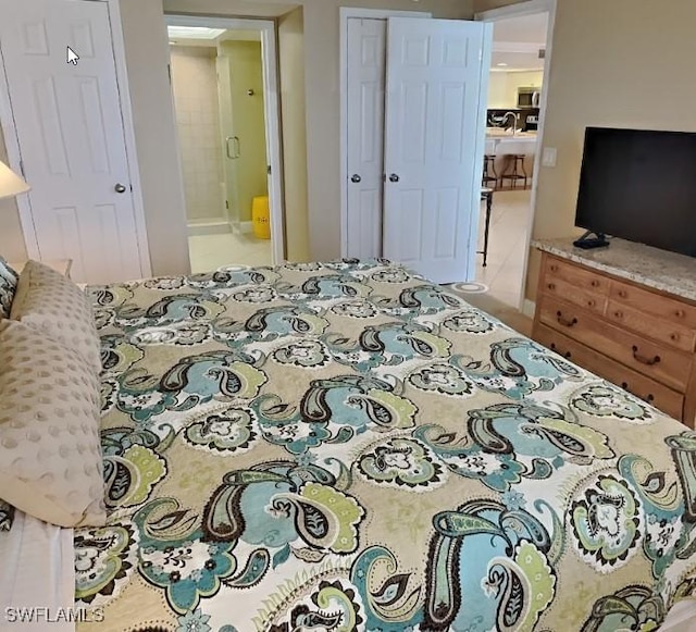 17170 Harbour Point Dr Unit 736, Fort Myers, FL 33908 - bedroom featuring a closet and ensuite bath