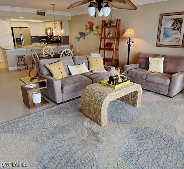 17170 Harbour Point Dr Unit 736, Fort Myers, FL 33908 - living area with crown molding, a ceiling fan, a chandelier, and light tile patterned floors