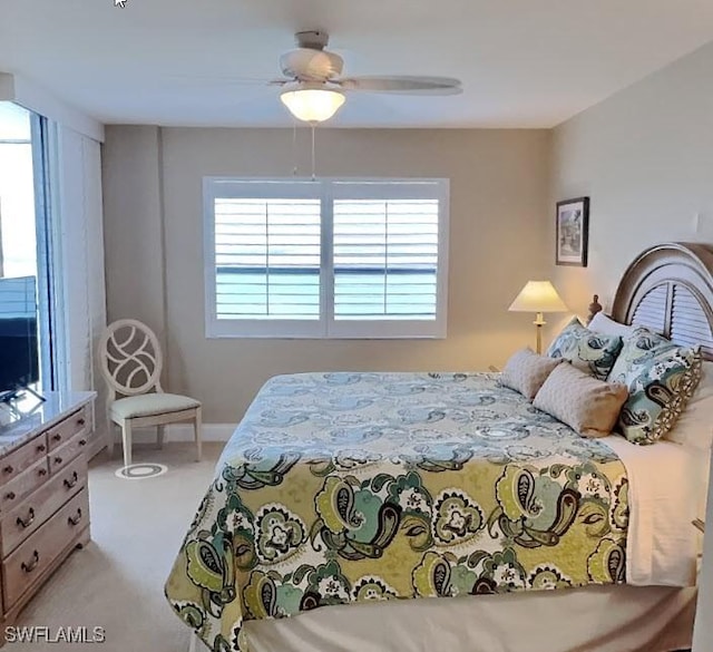 17170 Harbour Point Dr Unit 736, Fort Myers, FL 33908 - bedroom with light carpet and ceiling fan