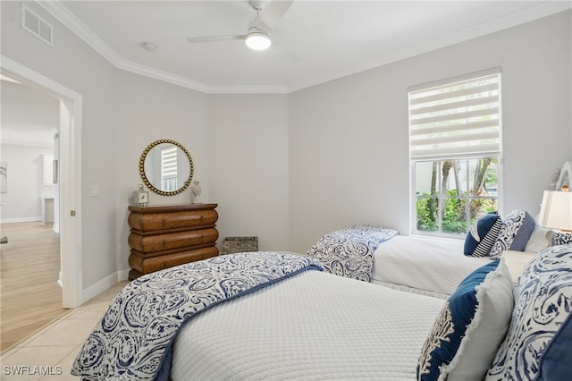 28657 San Lucas Ln Unit 102, Bonita Springs, FL 34135 - bedroom featuring crown molding, a ceiling fan, and light tile patterned flooring