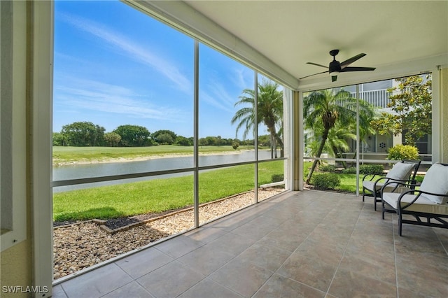 28657 San Lucas Ln Unit 102, Bonita Springs, FL 34135 - sunroom / solarium with a water view, a ceiling fan, and plenty of natural light