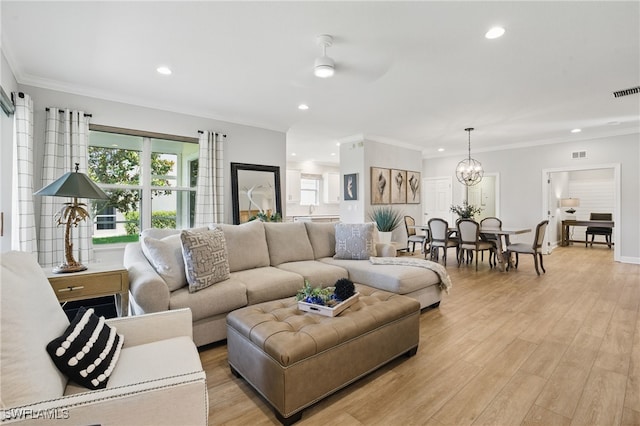 28657 San Lucas Ln Unit 102, Bonita Springs, FL 34135 - living area featuring recessed lighting, light wood finished floors, a chandelier, crown molding, and ceiling fan